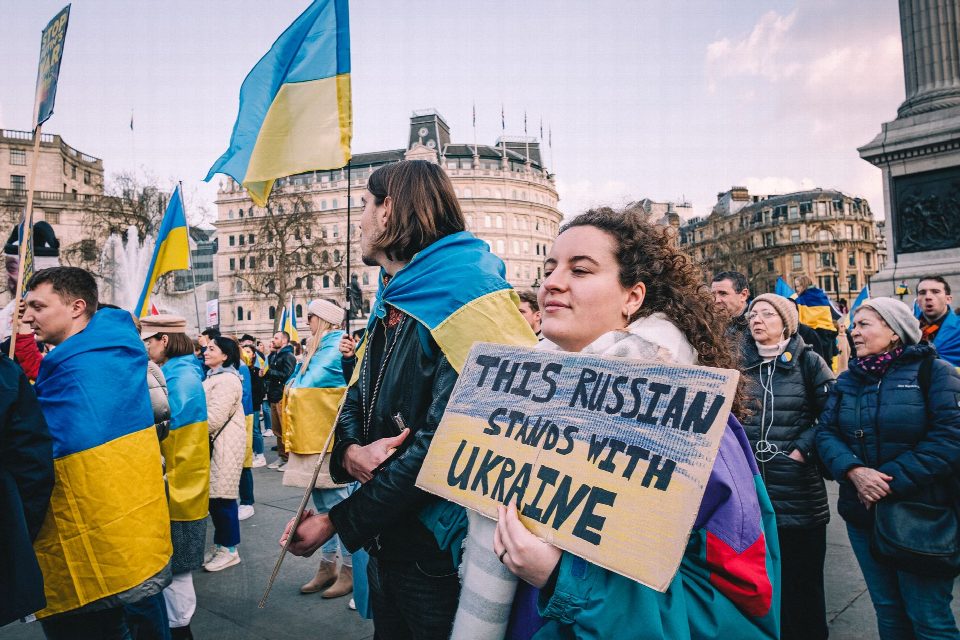 Crowd supporting Ukraine with flags at Trafalgar Square, London, England.